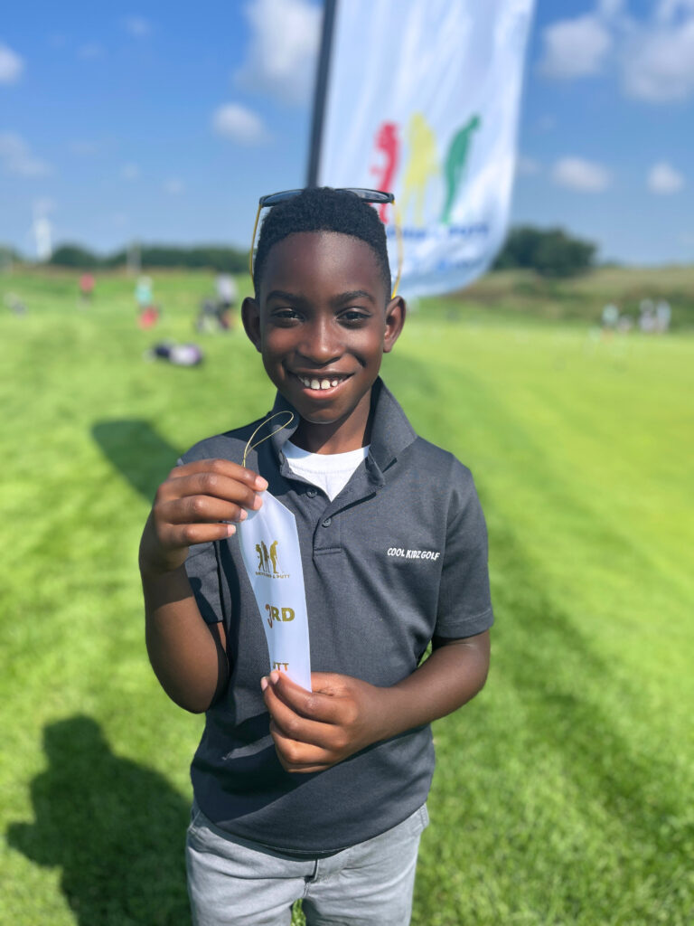 Calvin wins drive chip putt junior golfer competition at 7 years old. 