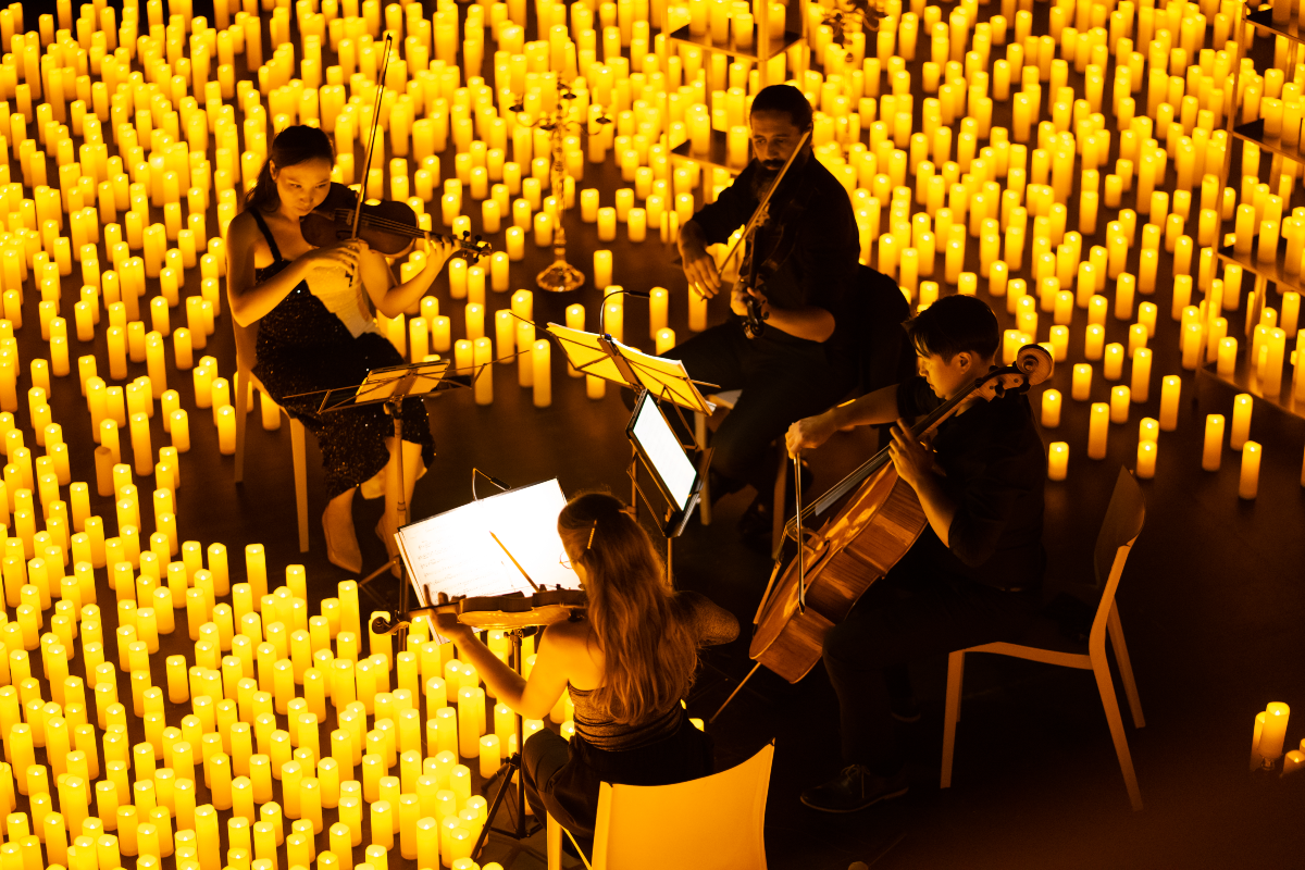 Candlelight concert with string quartet surrounded by candles in Chicago
