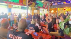 Bears fans watching the game on big screens at Utopian Tailgate Chicago rooftop